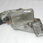Lancia Thema II Jeep WK 3.0 CRD eļļas filtra korpuss ar dzesētāju 68504665AA 68211440AB