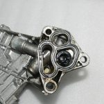 Lancia Thema II Jeep WK 3.0 CRD eļļas filtra korpuss ar dzesētāju 68504665AA 68211440AB