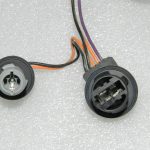 Lancia Thema II aizmugurējo gaismu instalācijas lukturu turētājs 68042174AE, K68042174AE