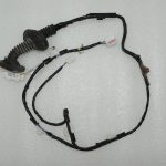 Toyota Yaris IV 1.5 HEV 68kW Aizmugurējo durvju elektroinstalācijas siksna aizmugurējā kreisā 82154K0180
