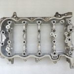 Toyota Yaris P13 1.5 16V 2NRFKE 82kw Sadales vārpstas korpuss 1110347903