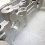 Toyota Yaris P13 1.5 16V 2NRFKE 82kw Sadales vārpstas korpuss 1110347903