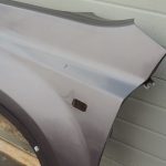 Nissan X-Trail T31 priekšējais kreisais dubļusargs kreisais spārns K55 Brownish Grey Met
