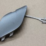 Opel Astra J Hečbeks aizmugurējā bampera stiprinājuma vāciņš Silver Lake GEV 13266588