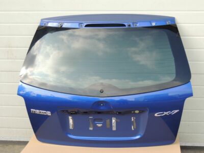 Mazda CX7 I MK1 aizmugurējā durvju apakšējā bagāžnieka vāka krāsa 34J Aurora Blue Mica