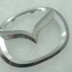 Oriģinālā Mazda 6 GJ priekšējā radiatora režģa emblēma Mascot GHP951731, GHP9-51-731
