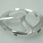 Oriģinālā Mazda 6 GJ priekšējā radiatora režģa emblēma Mascot GHP951731, GHP9-51-731