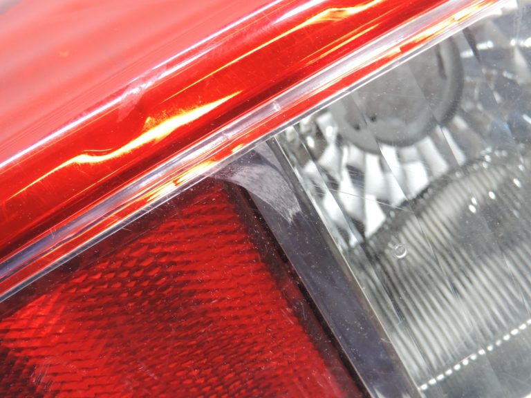 Oriģināls Nissan Navara II (D40) facelift aizmugurējais kreisais lukturis 26555EB38B