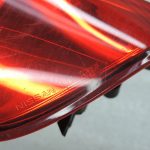 Oriģināls Nissan Navara II (D40) facelift aizmugurējais kreisais lukturis 26555EB38B