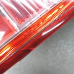 Oriģināls Nissan Navara II (D40) facelift aizmugurējais kreisais lukturis 26555EB38B