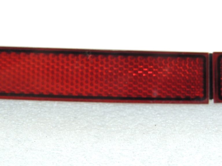 Volkswagen Tiguan II Aizmugurējā bampera kreisais atstarotājs 5NA945103 5NA945105A
