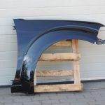 Nissan Navara II D40 priekšējais labais spārns, krāsa GN0, melns, F31004X0MA
