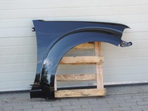 Nissan Navara II D40 priekšējais labais spārns, krāsa GN0, melns, F31004X0MA