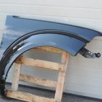 Nissan Navara II D40 priekšējais labais spārns, krāsa GN0, melns, F31004X0MA