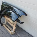 Nissan Navara II D40 priekšējais labais spārns, krāsa GN0, melns, F31004X0MA