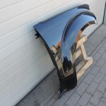 Nissan Navara II D40 priekšējais labais spārns, krāsa GN0, melns, F31004X0MA