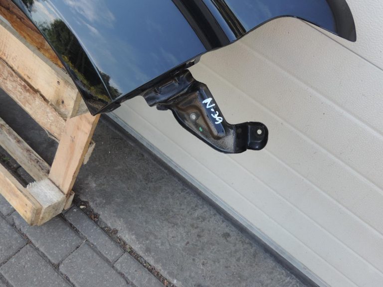Nissan Navara II D40 priekšējais labais spārns, krāsa GN0, melns, F31004X0MA