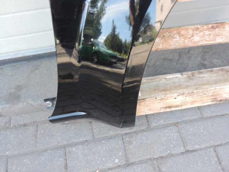 Nissan Navara II D40 priekšējais labais spārns, krāsa GN0, melns, F31004X0MA