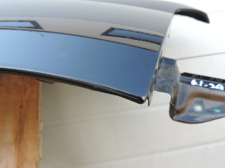 Nissan Navara II D40 priekšējais labais spārns, krāsa GN0, melns, F31004X0MA