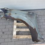Nissan Navara II D40 priekšējais labais spārns, krāsa GN0, melns, F31004X0MA