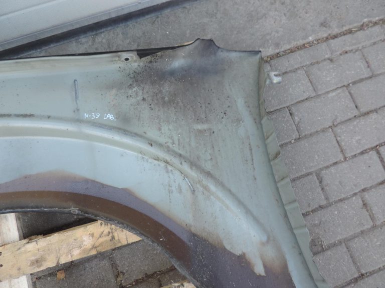 Nissan Navara II D40 priekšējais labais spārns, krāsa GN0, melns, F31004X0MA