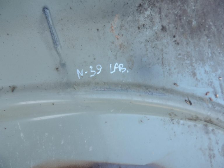 Nissan Navara II D40 priekšējais labais spārns, krāsa GN0, melns, F31004X0MA