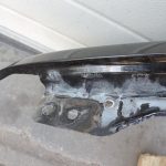 Nissan Navara II D40 priekšējais labais spārns, krāsa GN0, melns, F31004X0MA