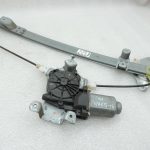 OE Nissan Navara II D40 aizmugurējā kreisā loga pacēlājs ar motoru 827013X30A