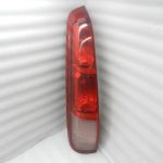 Nissan X-Trail T30 oriģinālais aizmugurējais lukturis (kreisais) 26555EQ025