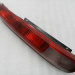 Nissan X-Trail T30 oriģinālais aizmugurējais lukturis (kreisais) 26555EQ025