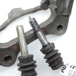 OE Toyota Corolla E21 aizmugurējā labās puses bremžu kluča kronšteins 4782109100