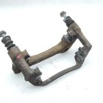 OE Toyota Corolla E21 priekšējā kreisā bremžu kluča kronšteins 4772209260