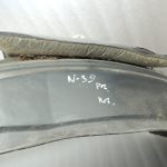 Nissan Navara II D40 2010-2013 Priekšējā kreisā iekšējā riteņa arkas ieliktnis 638413X00A