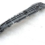 Oriģināls 2011-2014 Toyota Yaris P13 aizmugurējā bampera kronšteins kreisais 525760D130