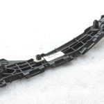 Oriģināls 2011-2014 Toyota Yaris P13 aizmugurējā bampera kronšteins kreisais 525760D130